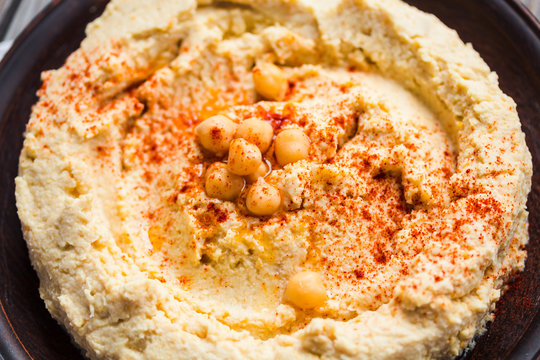 Homemade hummus of chickpeas, tahini paste and with paprika in a