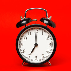 Alarm clock on red