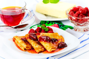 Pancakes with strawberry jam.