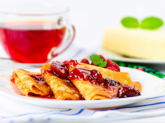 Pancakes with strawberry jam.