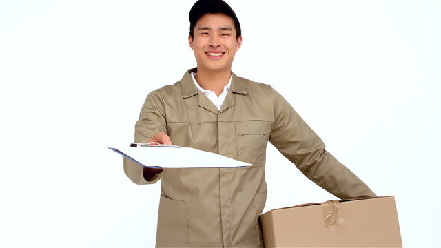 Smiling Asian postman handing document to sign