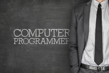 Computer programmer on blackboard