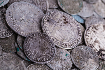 trove of ancient medieval coins silver background