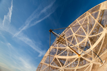 old functional radio telescope in the sunset