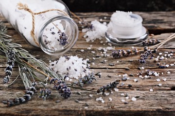 Lavender salt and dried lavender on a rustic wooden table. Toned image.Selective focus