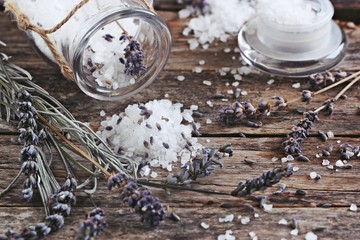 Lavender salt and dried lavender on a rustic wooden table. Toned image.Selective focus