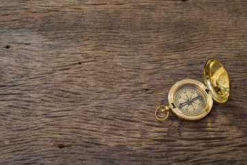 Old Compass on wood background