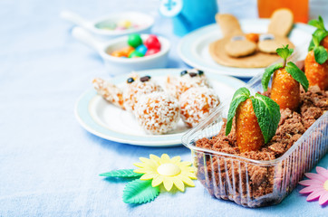 Easter background with sweets and juice for kids