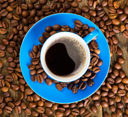 Coffee and coffee bean on wood background