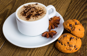 Coffee cup and coffee beans on table