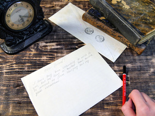 Woman hand write letter on vintage background
