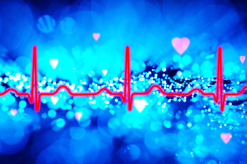 Heartbeat ekg with bokeh background lights and hearts.
