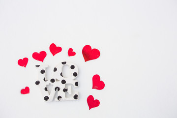 Red hearts on white snow