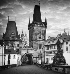 Famous Charles Bridge in Prague  - view to the Old City - travel background, black and white version