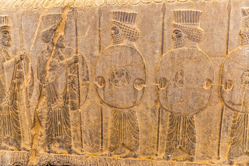 Guardians also known as the Immortals holding a spear, relief detail on the stairway facade of the Apadana at the old city Persepolis.