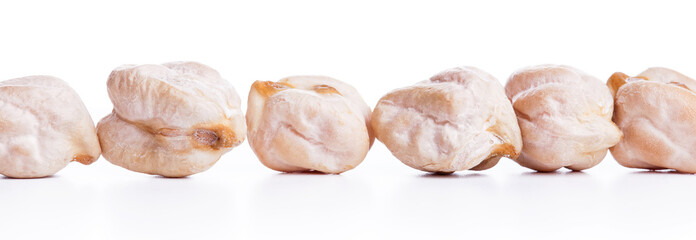 Align raw dry chickpeas on white background