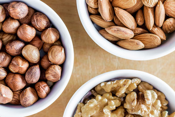 Three bowls of assorted nuts