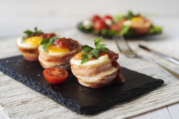 Fried eggs with cheese and bacon