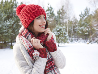 Pretty woman with red hat smiling in winter day