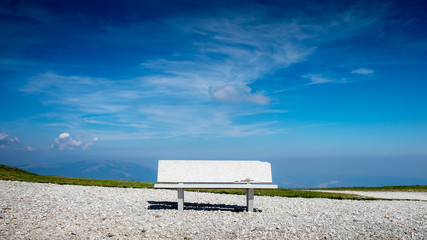 Obraz premium Marble bench on top of the mountain