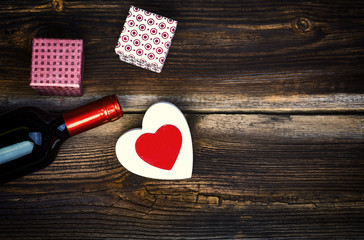 White And Red Wooden Hearts, Bottle Of Wine And Gift Boxes On Wooden Board. Love Concept. Valentines Day Background.