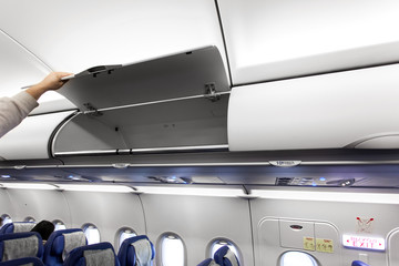 Naklejka premium Airplane interior with luggage compartments