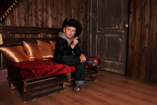 Boy in the image of a cowboy