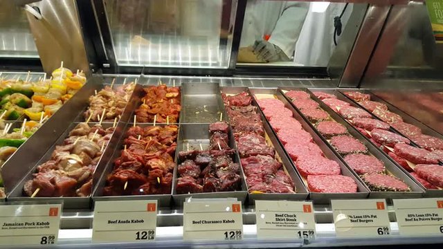 Butcher Packing Meat at Butchery Market 4K