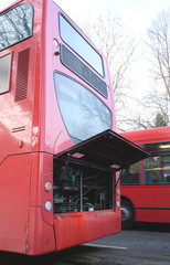 Fototapeta premium Damaged red public bus with open bonnet