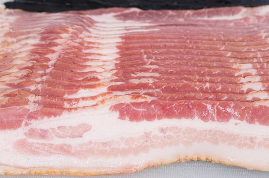 Close-up shot of raw bacon slices