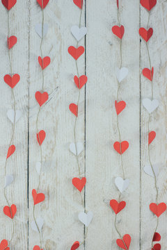Valentine’s hearts on rustic wooden texture background 