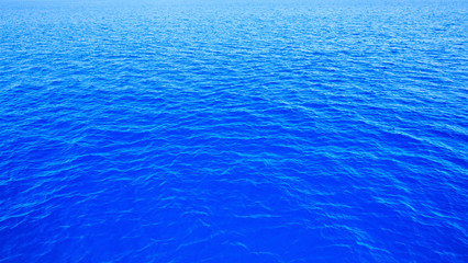 Blue pool water with sun reflections