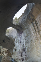 Prohodna is a karst cave in north central Bulgaria, next to the Karlukovo village