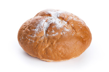 Homemade whole round bread sprinkled with flour