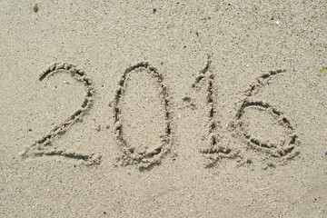 2016 sign on beach sand