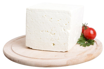 chunk cheese on cutting plank