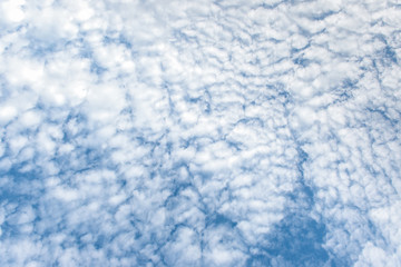 The blue sky with clouds, background