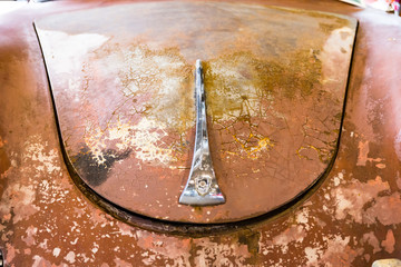 Detail of old German rusty car called "beetle" to be restored.