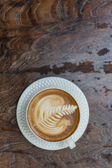 Cup of latte Coffee on wood table