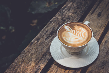 Cup of latte Coffee on wood table