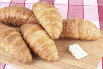 croissant bread on wooden board, breakfast