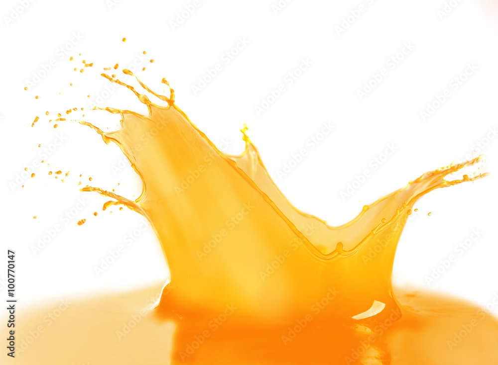 Wall mural Splashing orange juice isolated on white