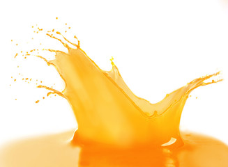 Splashing orange juice isolated on white