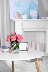 Fototapeta na wymiar Beautiful rose in vase on table in room