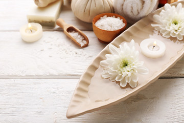 Spa composition and treatments on light wooden background, close-up