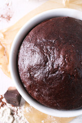 Cooked chocolate pie in a baking tray on a table, top view