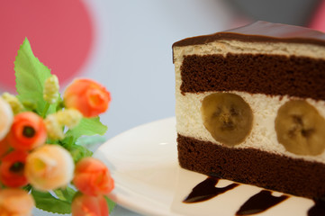 Piece of banana chocolate cake in restaurant