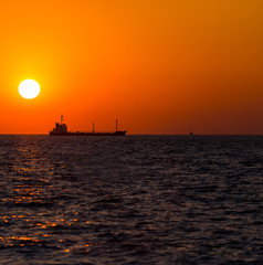 Fototapeta na wymiar shipping boat in sunset time