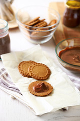 Melted chocolate onplate, on wooden background