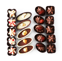 Delicious chocolate candies on white background